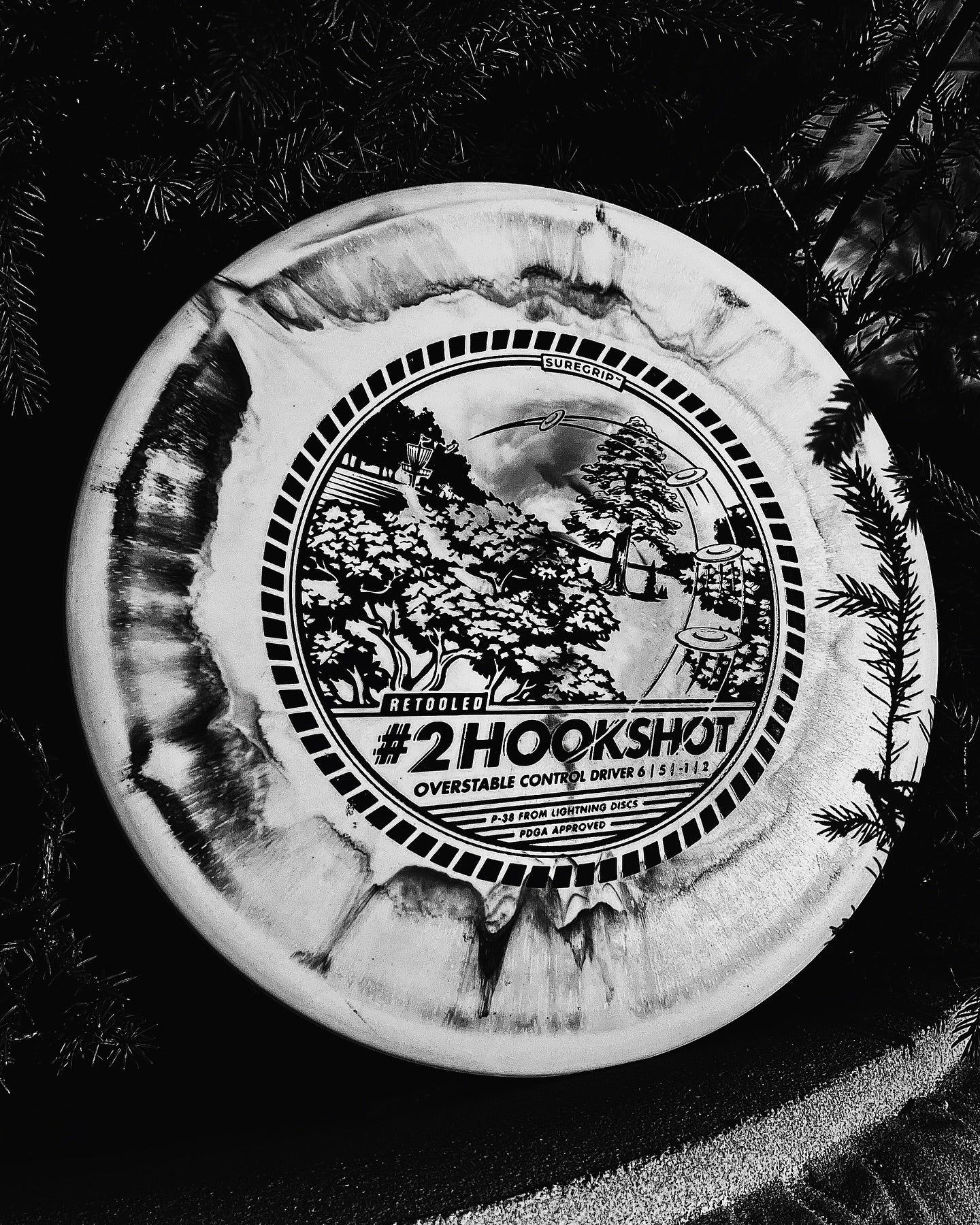 #2 Hookshot by Lightning Discs, molded in Sure Grip plastic for extra feel and control, offering a consistent overstable flight ideal for hyzer approaches and dependable fades.