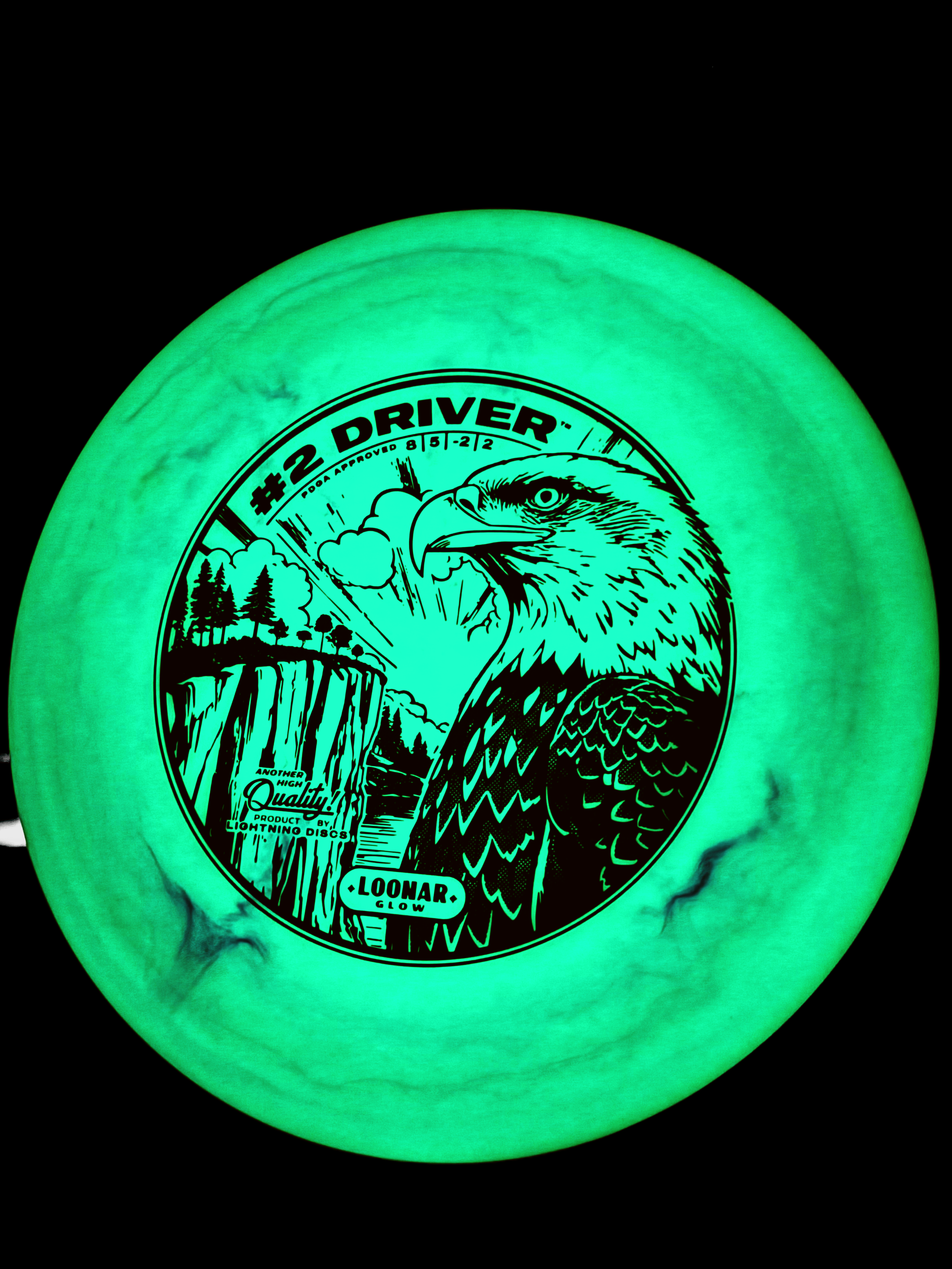 #2 Driver by Lightning Discs, shown in Loonar Glow plastic that glows brightly at night and floats in water, with a durable, grippy feel and ideal for controlled distance shots.